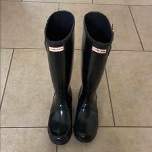 Tall black glossy hunter rain boots